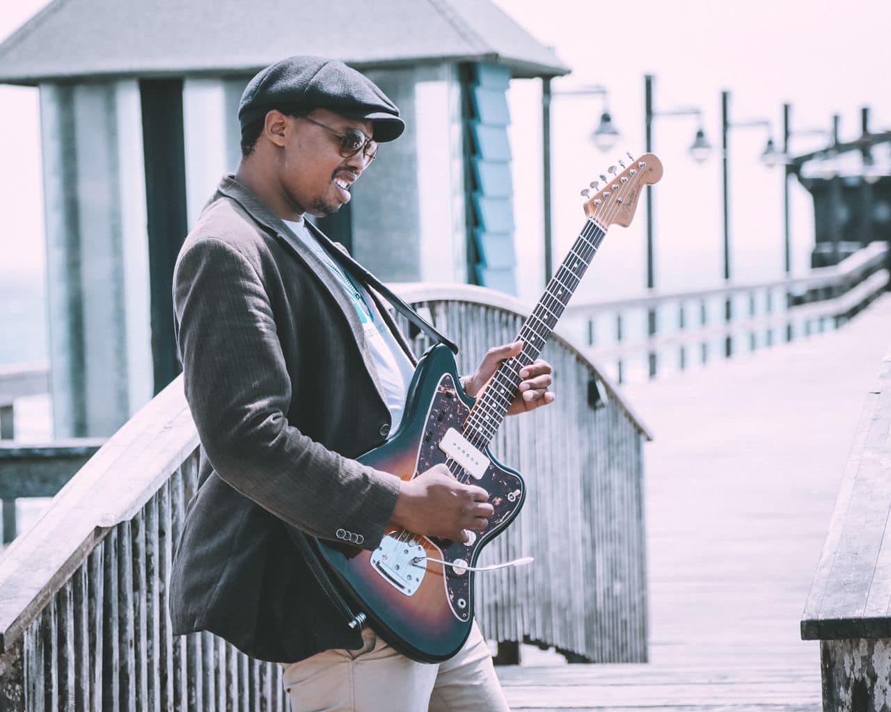 Sagarias Tsam playing a rock guitar on the Swakopmund jetty